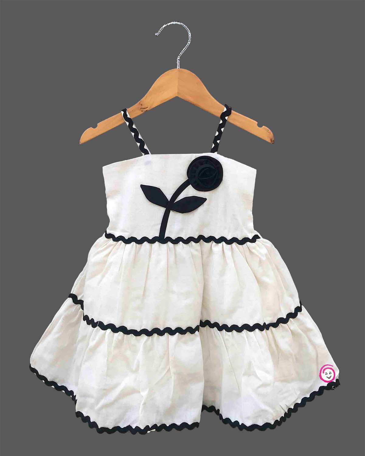 Baby Girl Tiered Frock with flower applique and zig-zag trim detailing for birthday Western wear .