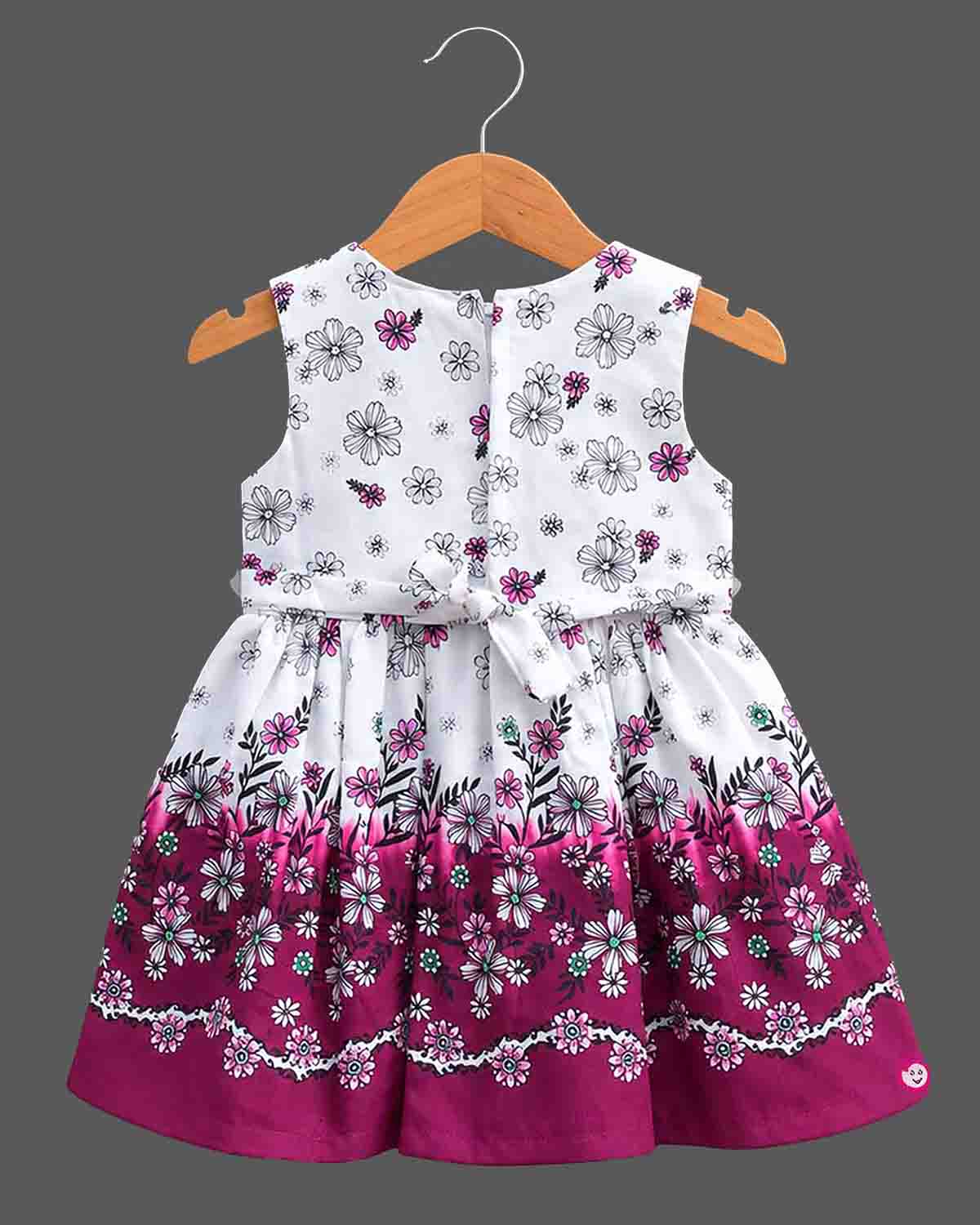 Sleeveless floral printed cotton frock with bow detail for baby casual wear dress collection.