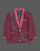 Maroon formal suit for little boys featuring a blazer with black and silver sequin details, a grey collar accent, white shirt, black tie, and matching maroon pant against a grey background.