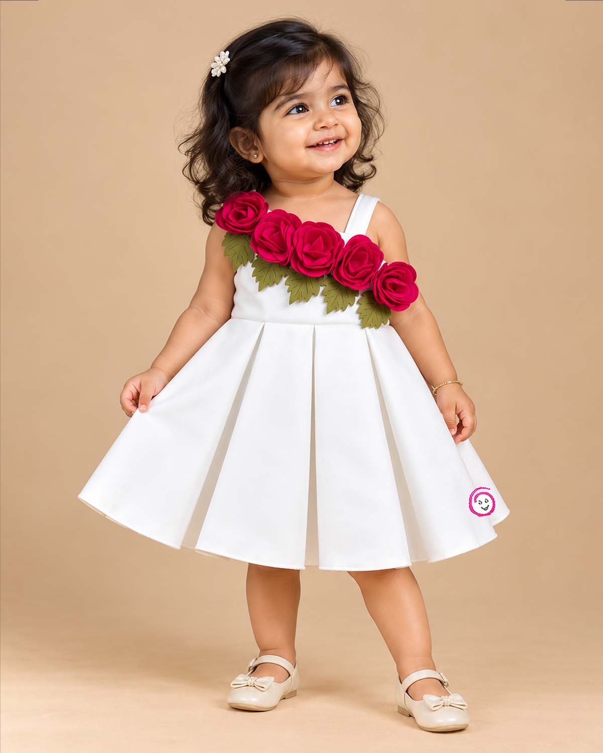 Baby girl scuba frock featuring structured box pleats and dimensional rose appliques for party wear
