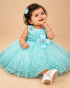 Girls sequined net fit-and-flare frock with floral embellishments and bow applique for birthday parties