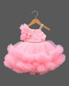 Tiered ruffle high-low silk frocks for baby girl featuring asymmetrical shoulder frills and sequin embroidery.