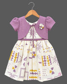 Little girl purple and off-white printed cotton casual frock with attached short sleeve jacket and floral brooch