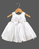 Infant girl sleeveless party frock with large front bow, beaded waistband, and pearl embellished neckline for special occasions