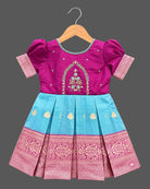 Embroidered pattu frock for baby girl with puffed sleeves, zari border, and box-pleated silhouette.