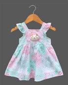Sleeveless cotton Schiffli eyelet frock with delicate floral print and cat face motif on front bodice.