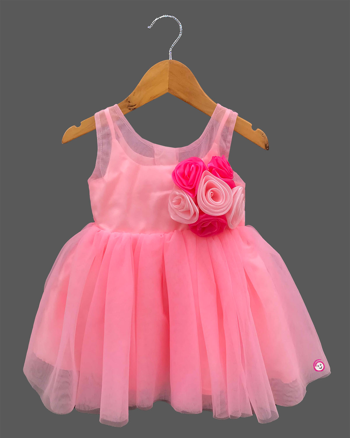 Sleeveless fairy-tale celebration attire for toddlers featuring layered net flare and handcrafted floral bodice appliques.