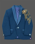 Boys embroidered tuxedo suit set featuring metallic shoulder embroidery, satin shawl lapel blazer, tie, and pant.