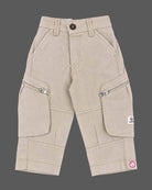Detailed view of party wear for boys featuring denim button shirt with graphic prints and cargo Pant.