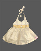 Little one wearing halter neck traditional ethnic dress with delicate lace waist trim and floral applique.