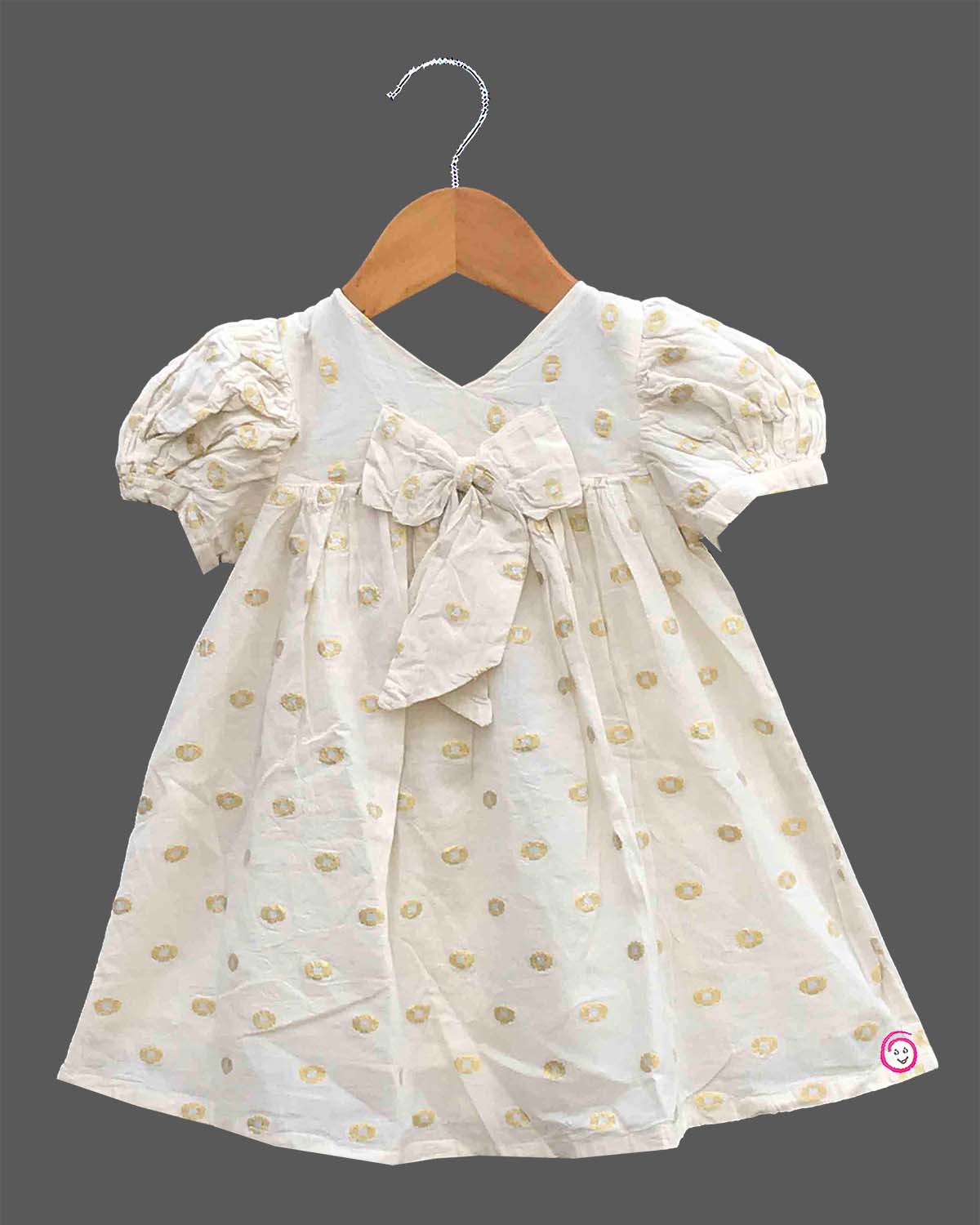 Little princess jacquard frock with front bow accent puff sleeves and woven circular motif detail
