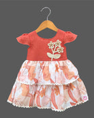 Little girl tiered printed casual frock with cap sleeves and floral crochet applique