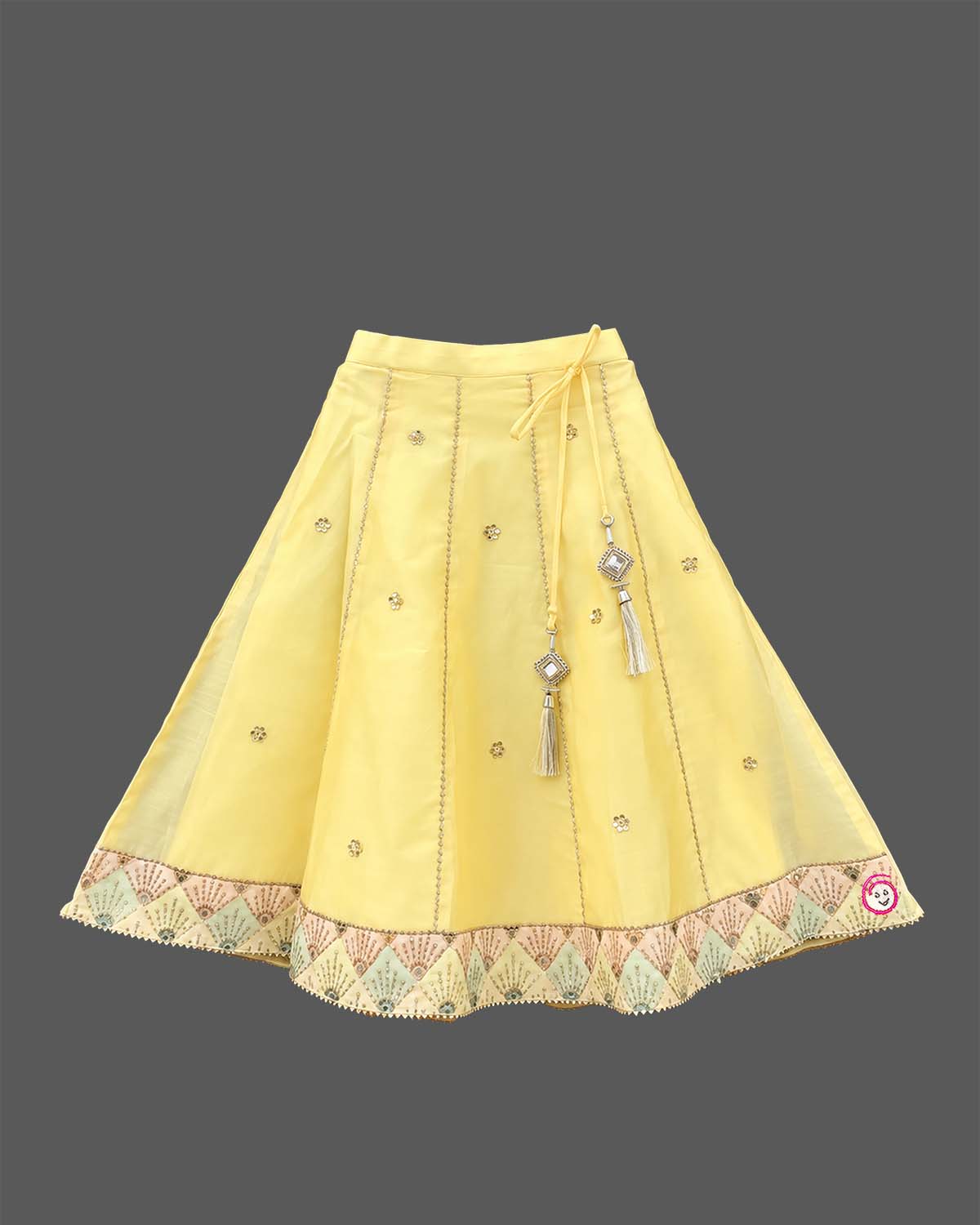 Girls sleeveless embroidered choli with square neck and flared ghagra skirt featuring tassel accents