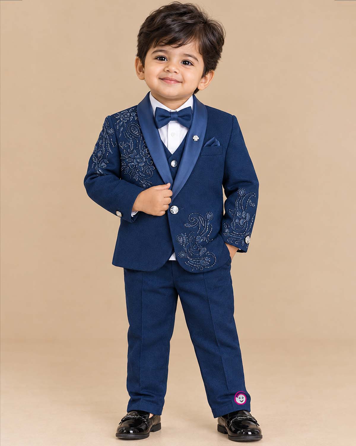 Boys paisley beaded tuxedo suit set with satin shawl collar blazer, waistcoat, bowtie, and dress pant for events.