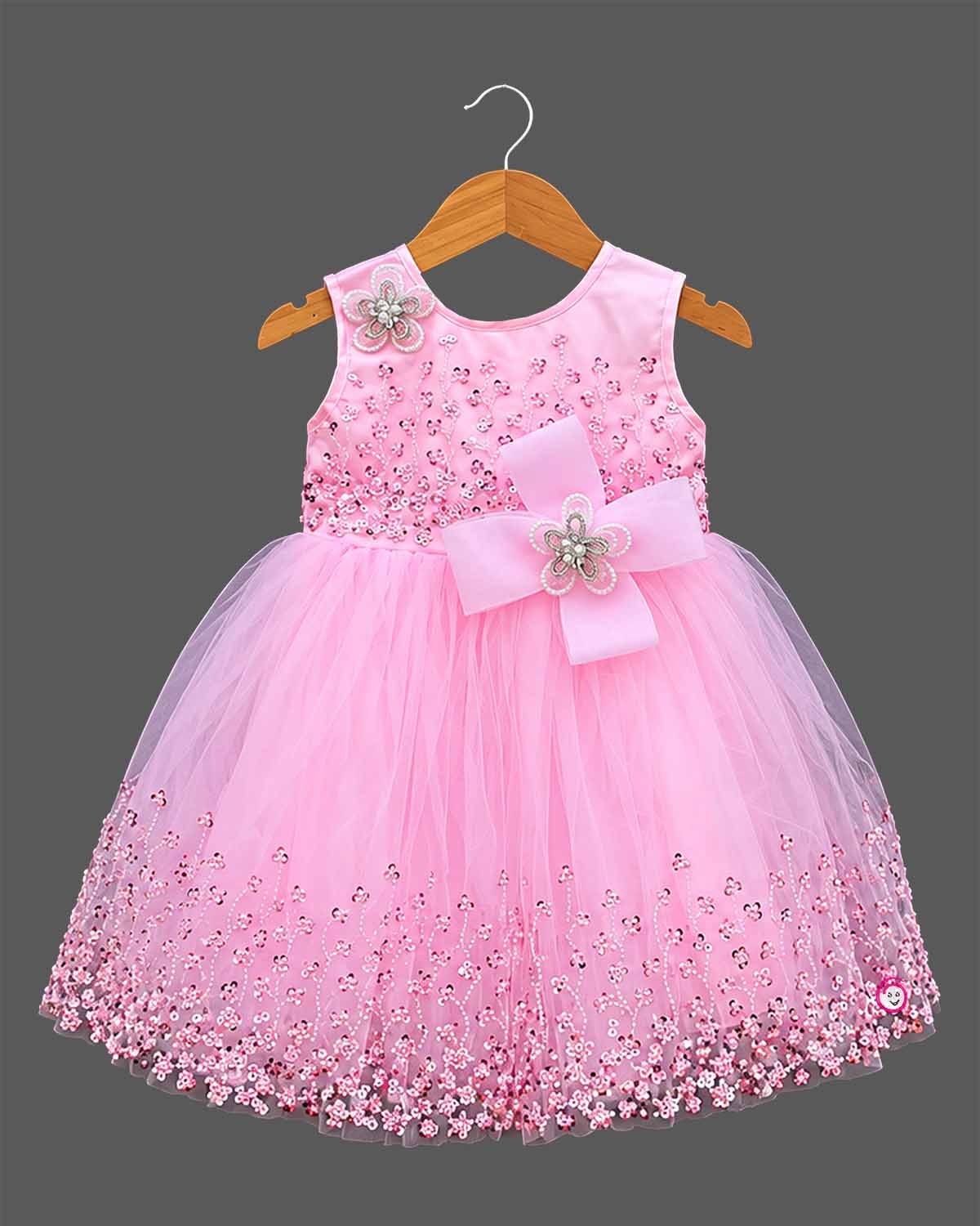 Girls sleeveless tulle party frock with sequined bodice embroidery, pearl flower applique bow, and flared net skirt