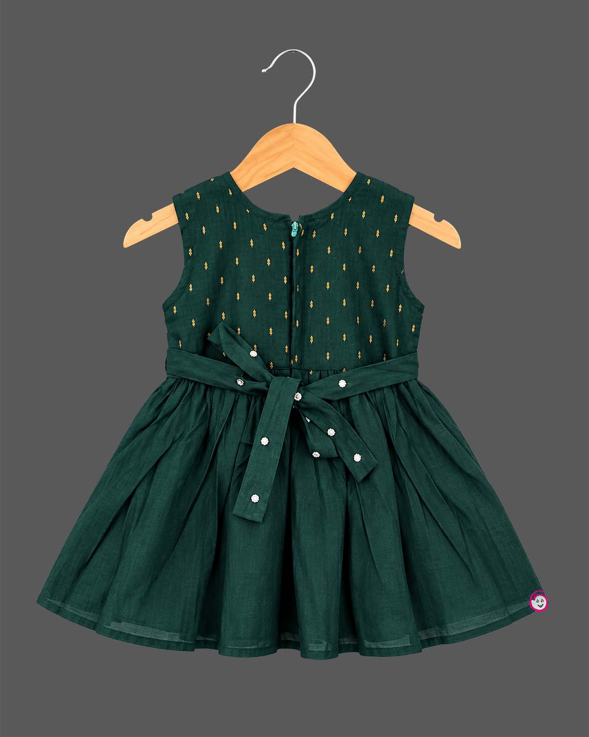 Sleeveless pattu frock with woven yoke detail and pleated floral flare for baby girls.