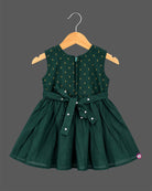Sleeveless pattu frock with woven yoke detail and pleated floral flare for baby girls.
