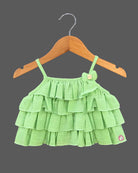 Charming top and skirt set for little princess featuring a multi-tiered ruffled strap top paired with a delicate embroidered net skirt on a hanger.