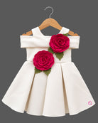 Girls cold shoulder pleated satin frock with 3D floral appliques and flared skirt for party wear.