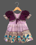 Charming ethnic pattu pavadai style cotton silk frock for baby girls with gold zari border and traditional motifs