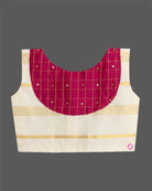A sleeveless top with a checkered patch and a gold-striped skirt for Onam traditional wear.