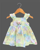 Sleeveless floral printed Schiffli cotton dress for toddlers with ruffled shoulder straps and a chest bow detail.