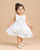Kids party wear satin A-line frock with large rosette flower accents, matching headband, and soft booties set.