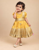 Toddler yellow cotton silk frock with border for festive wear