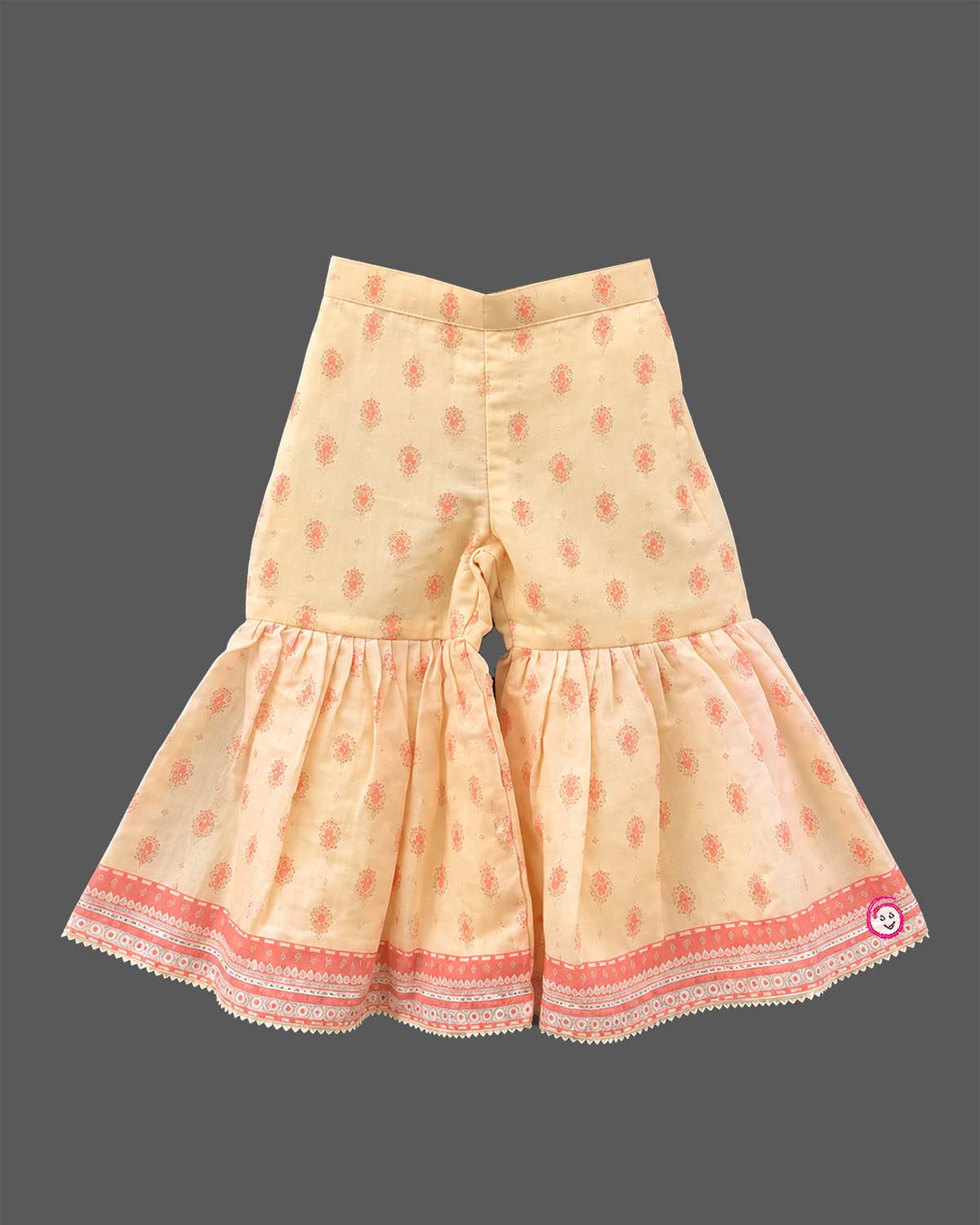 Girls printed short kurta with scalloped hem and matching tiered flared sharara pants for ethnic wear.