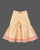 Girls printed short kurta with scalloped hem and matching tiered flared sharara pants for ethnic wear.