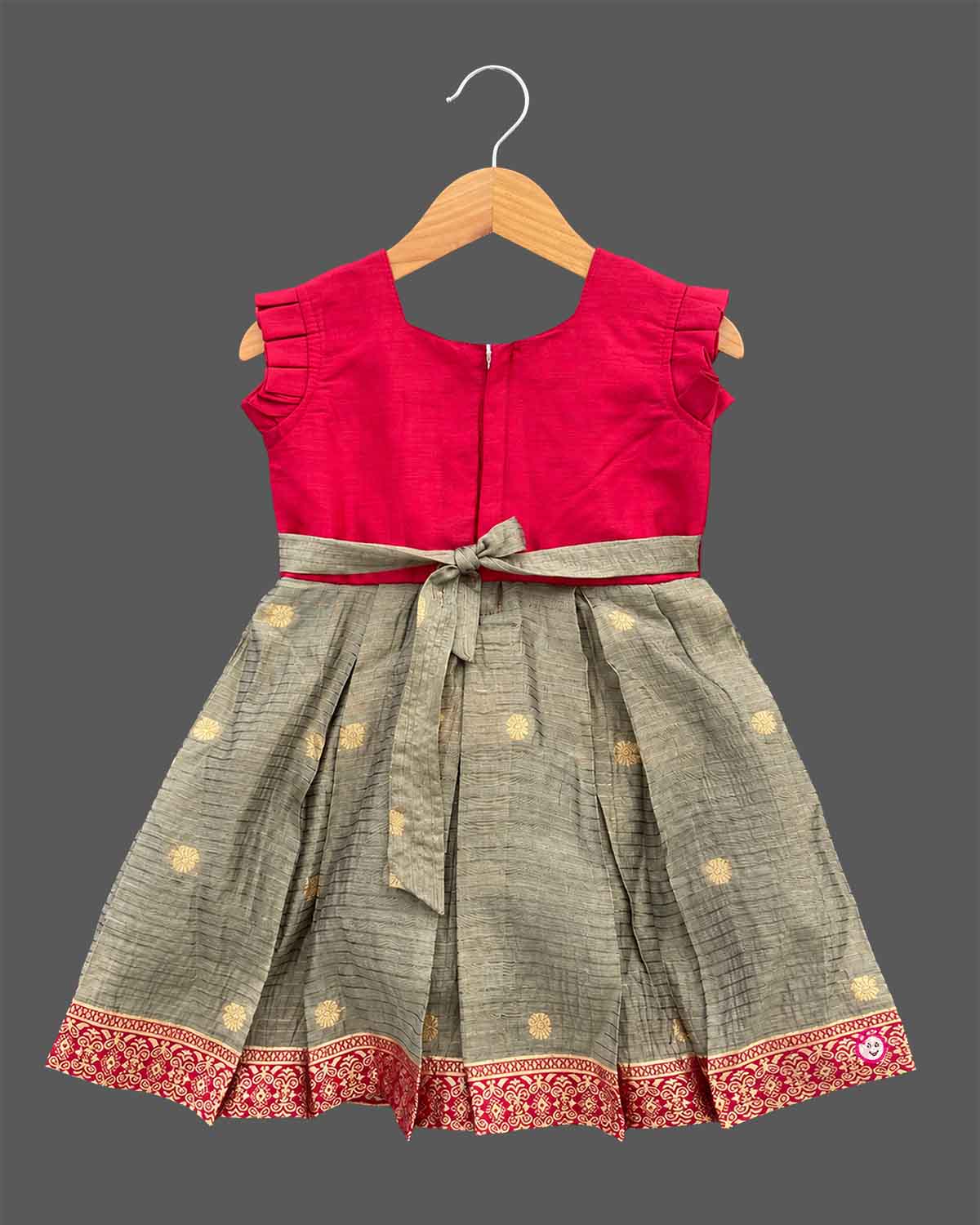 Girls silk blend embroidered box pleated frock with zari neckline detail and woven elephant motif border for kids