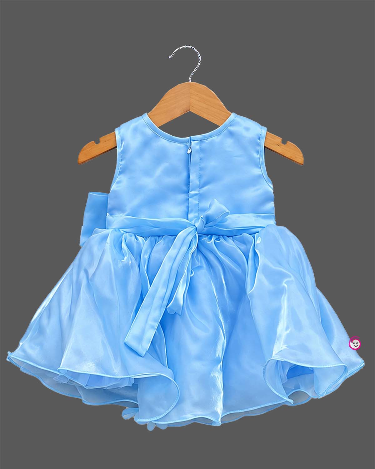 Girls organza party frock with sequined bodice, 3D shoulder flower, waist bow, and flared skirt with pearl tassels.