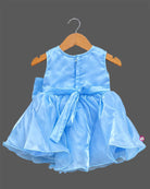 Girls organza party frock with sequined bodice, 3D shoulder flower, waist bow, and flared skirt with pearl tassels.