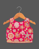 Girls floral embroidered sleeveless choli and tiered ruffle lehenga skirt set with drawstring tassel accents.