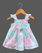 Sleeveless cotton Schiffli eyelet frock with delicate floral print and cat face motif on front bodice.