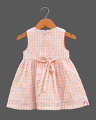 Infant gingham checkered frock featuring butterfly embroidery and sleeveless cut