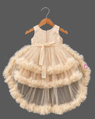 Beige cream net party frock for girls featuring sequin floral embroidery, sleeveless bodice, and tiered ruffle high-low hem design
