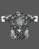 Stylish toddler boys shirt featuring an all-over classic designer motif print with double front flap pockets.