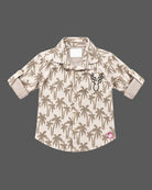 Boys button-down shirt and cargo pant set designed as party wear for boys with tropical print and chest embroidery.