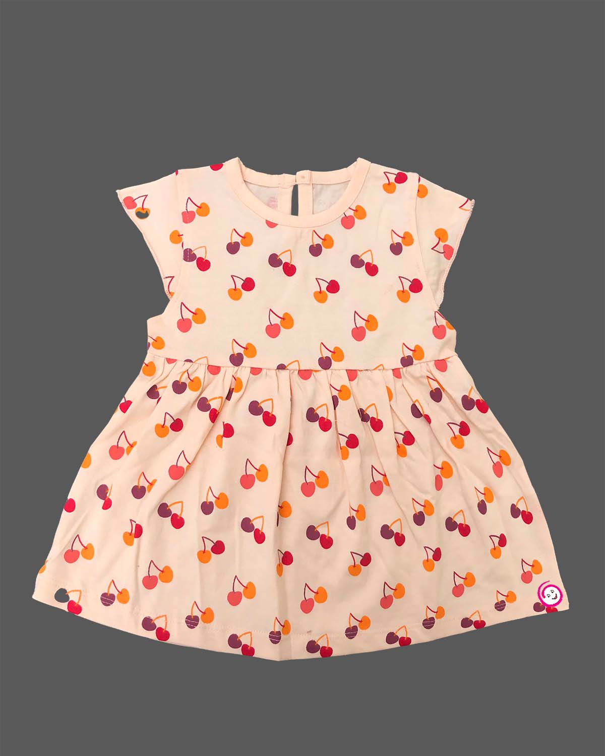 Infant cotton frock with short puff sleeves and printed pattern for casual outing