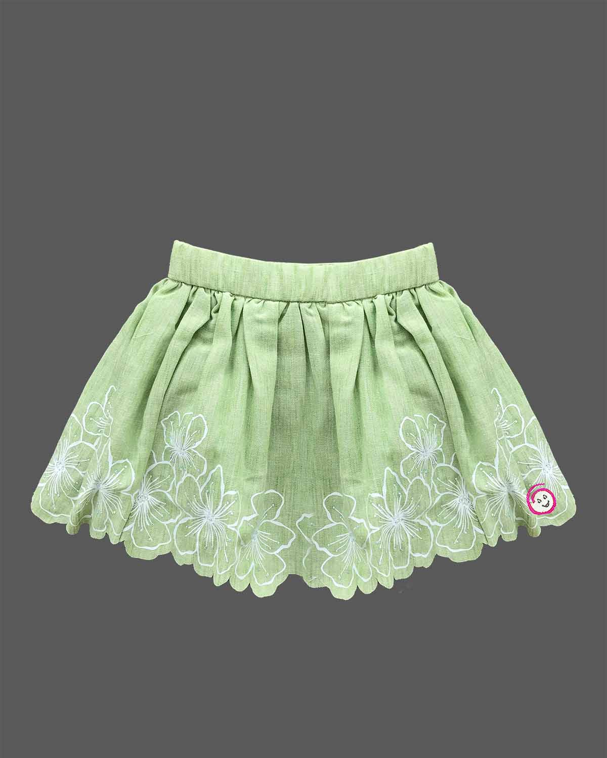 Sleeveless ruffle strap top paired with a flared embroidered skirt for a young fashionista.