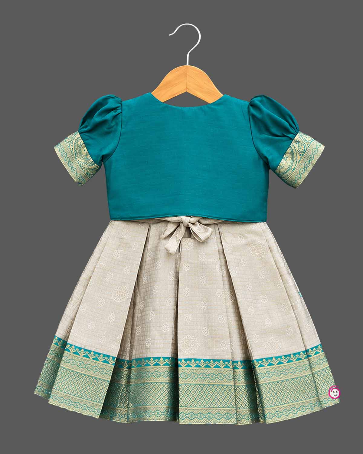 Infant silk frocks for baby girl featuring layered puffed sleeves, and ornate pleated brocade skirt.
