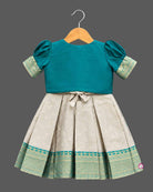 Infant silk frocks for baby girl featuring layered puffed sleeves, and ornate pleated brocade skirt.