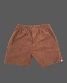 Short sleeve collared shirt with geometric front motifs paired with ribbed corduroy shorts for boys