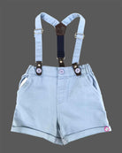Stylish young boy's printed shirt with a blue bow tie and coordinating suspender shorts set.