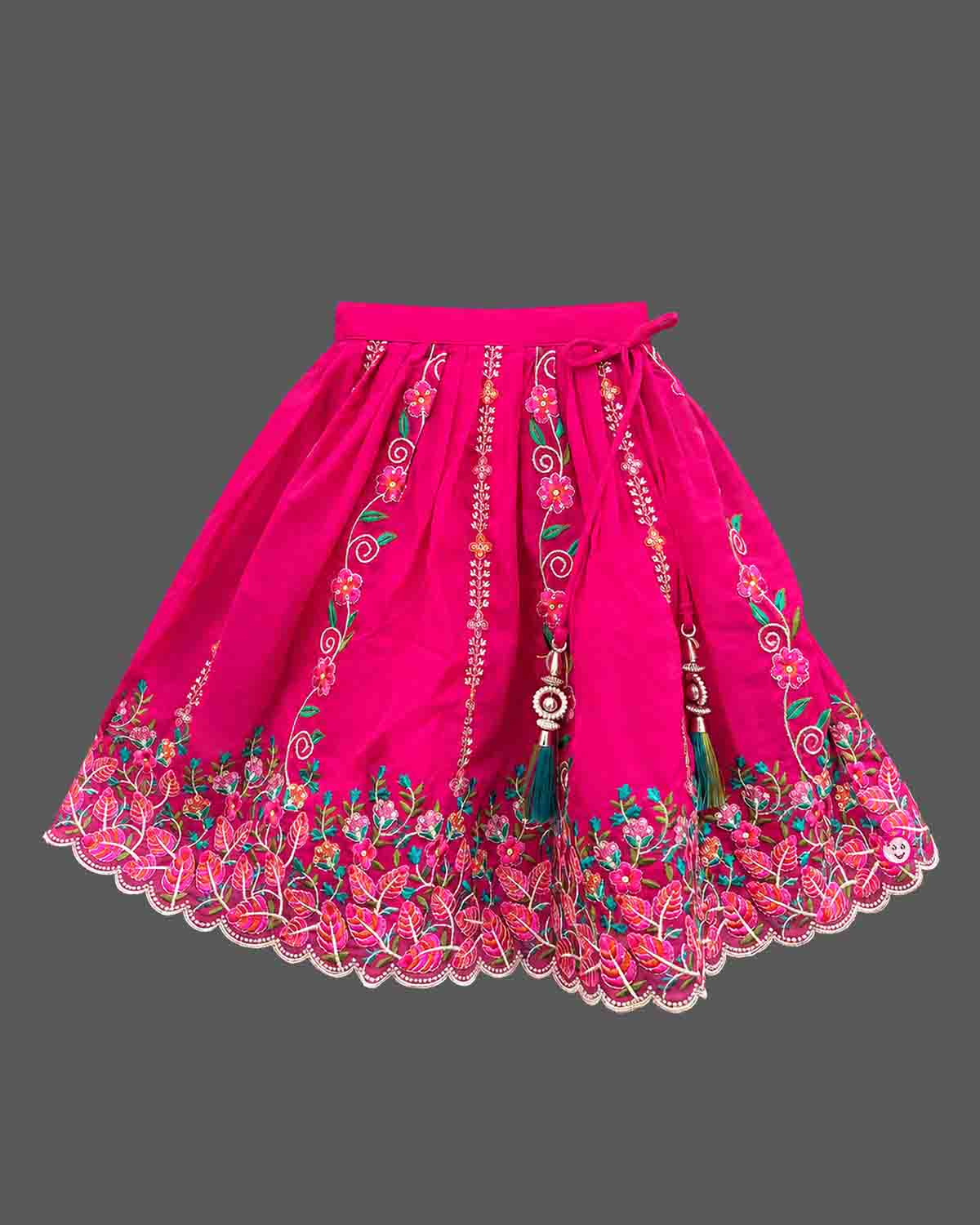 Detailed view of sleeveless embroidered lehenga choli for kids featuring scalloped floral hems.