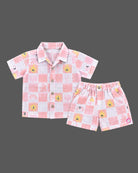 Co-ord set for baby boy featuring a button-down checkered shirt and matching shorts with sun graphics