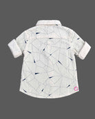 Boy button-down shirt with geometric linear pattern and roll-up sleeves for party wear for boys.