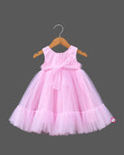 Little girl in soft pink net frock with floral appliqués and shimmer bodice for birthday parties