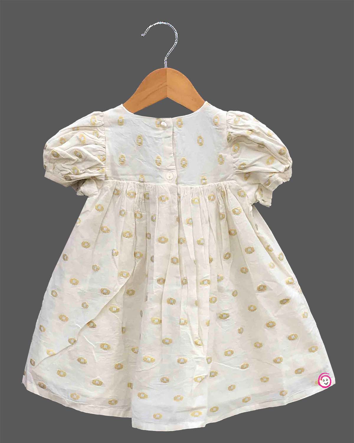 Little princess jacquard frock with front bow accent puff sleeves and woven circular motif detail